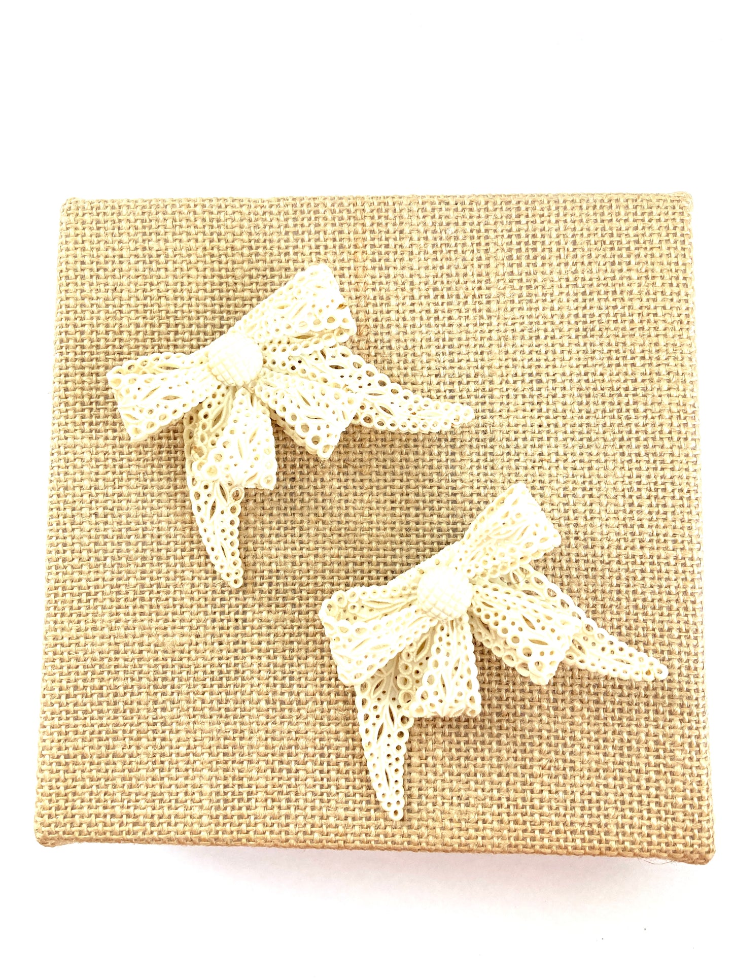 Pair of Celluloid Bow Brooches in Pierced Ivory
