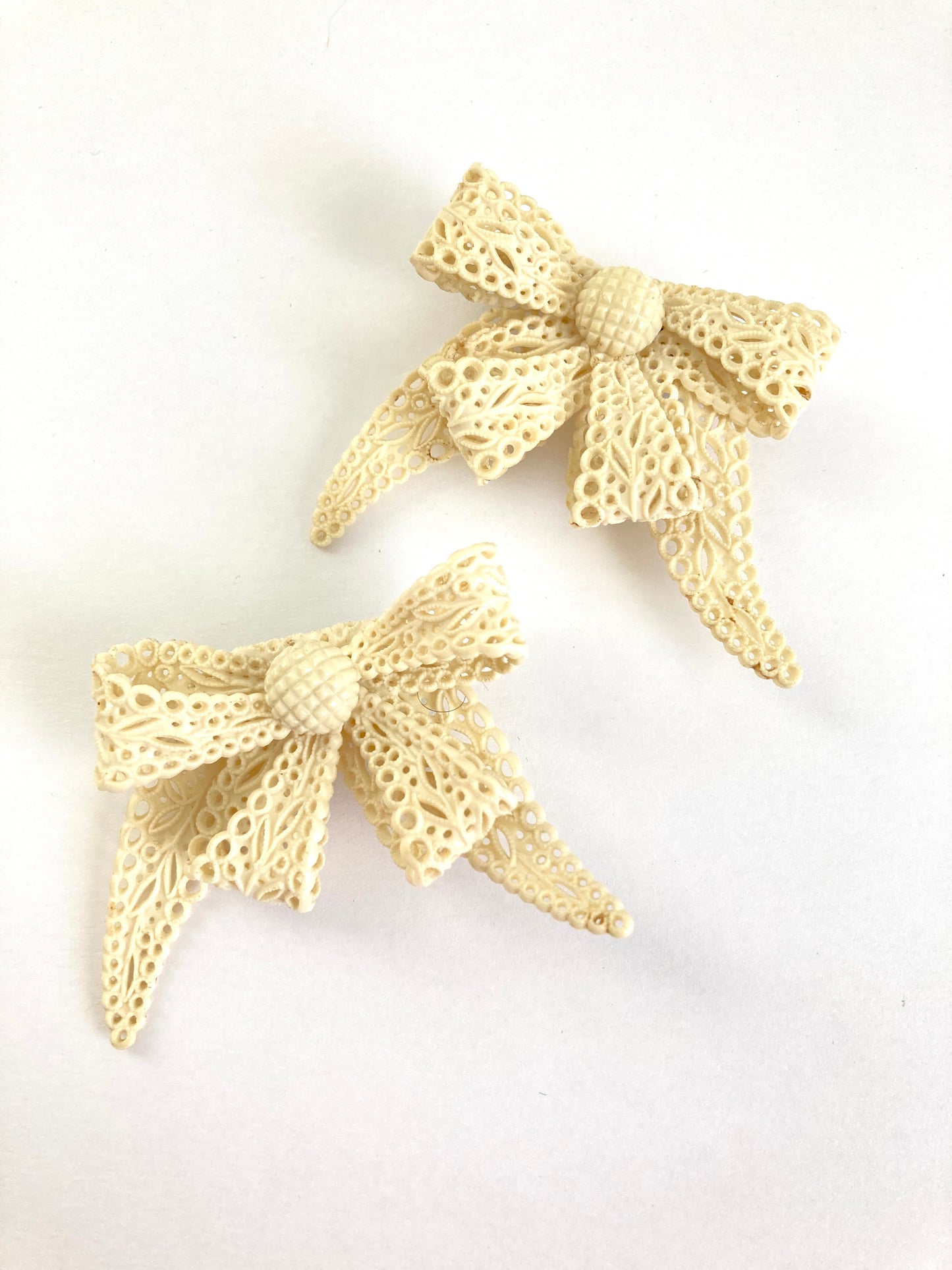 Pair of Celluloid Bow Brooches in Pierced Ivory