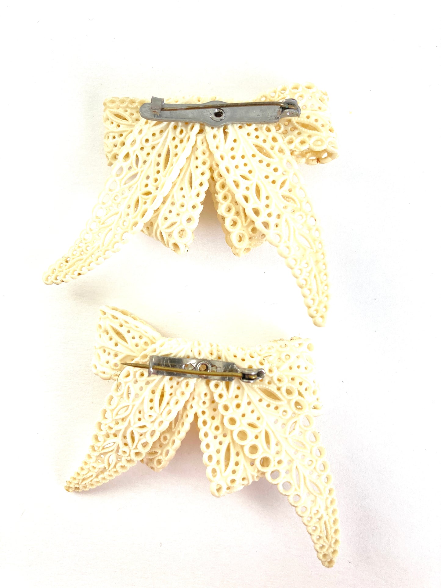 Pair of Celluloid Bow Brooches in Pierced Ivory