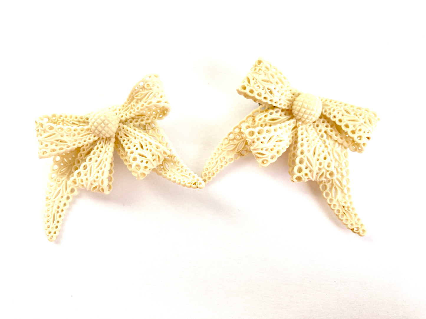 Pair of Celluloid Bow Brooches in Pierced Ivory