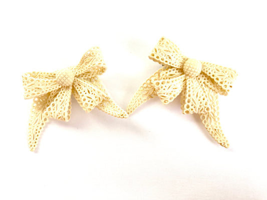 Pair of Celluloid Bow Brooches in Pierced Ivory