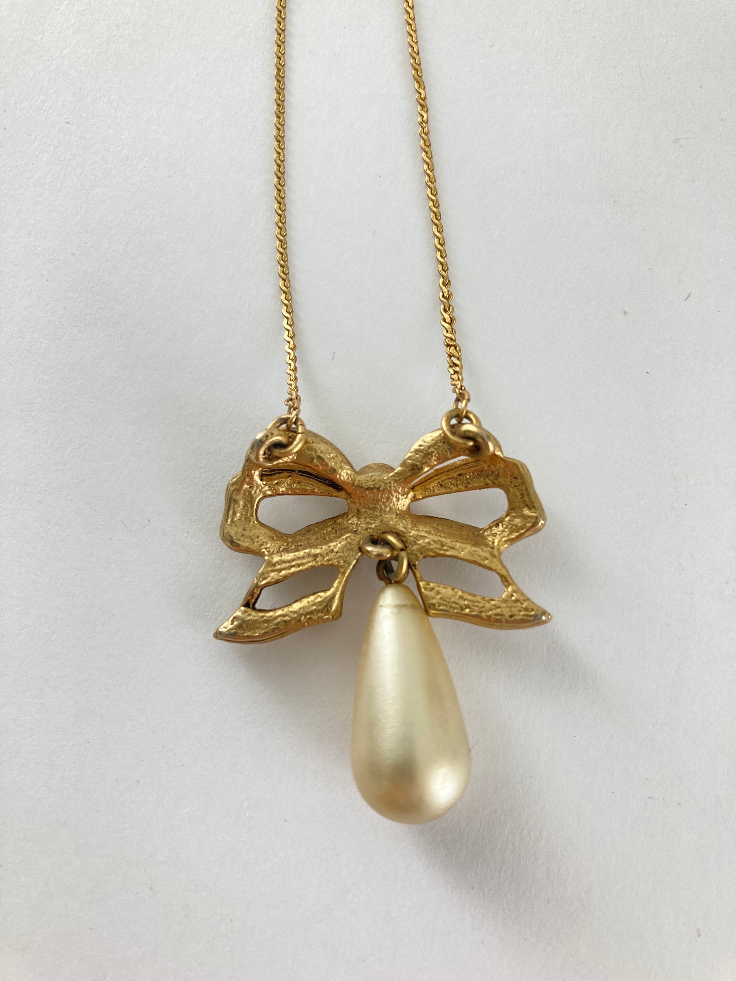 Golden Bow with Teardrop Pearl Necklace