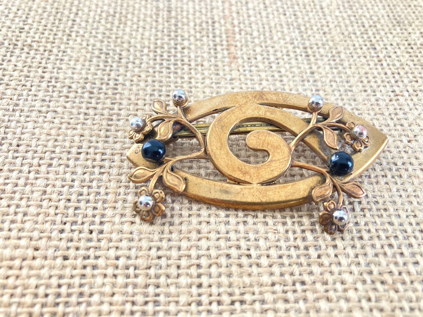 Antique stamped brass brooch with flowers