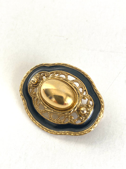 Oval Goldtone and Black Enamel Brooch
